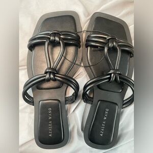 Black faux leather her sandals never worn